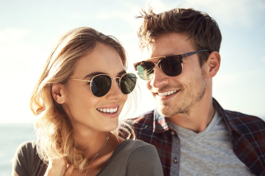 happy couple wearing sunglasses